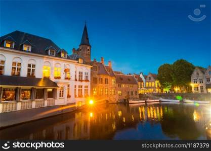 Belgium, Brugge, old European town with buildings on river, night view. Tourism and travels, famous europe landmark. Belgium, Brugge, old European town, night view
