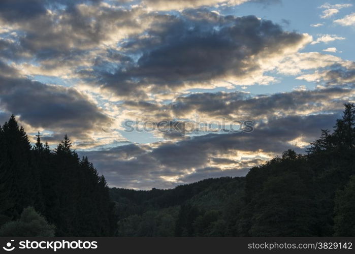 belgium nature with clouds and sunshine