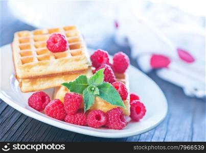 belgium wafer with fresh raspberry on the plate