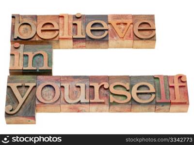 believe in yourself - motivation concept - isolated text in vintage wood letterpress printing blocks