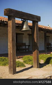 Bell hanging in front of a house