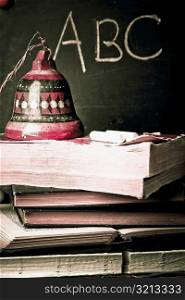 Bell on a stack of books