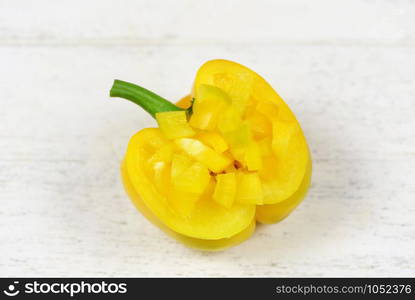 Bell pepper on white wooden background / Yellow bell pepper slice for cooked food