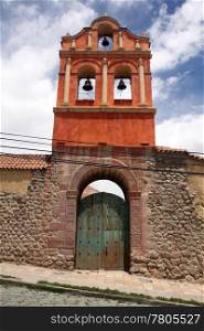 Bell tower, gate and wall on the street in Potosi, Bolivia