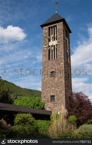 Bell tower of monastery Ebernach with blue sky, Cochem, Germany