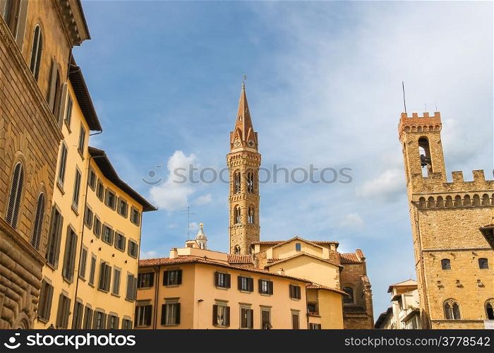 Bell tower of Palazzo del Bargello and church spire of Badia Fiorentine in Florence, Italy