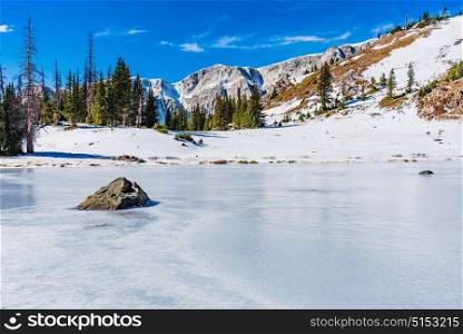 Bellamy Lake frozen over in Medicine Bow National Forest