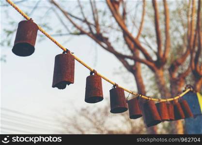 Bells arranged together during the sunset