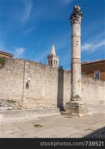 Belltower and Pillar of Shame in the ancient old town of Zadar in Croatia. Bell Tower in the old town of Zadar in Croatia