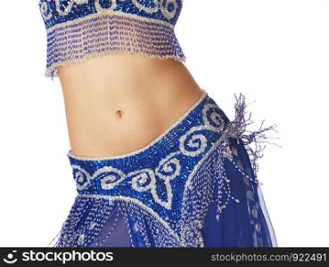 Belly dancer in blue traditional dress on a white background