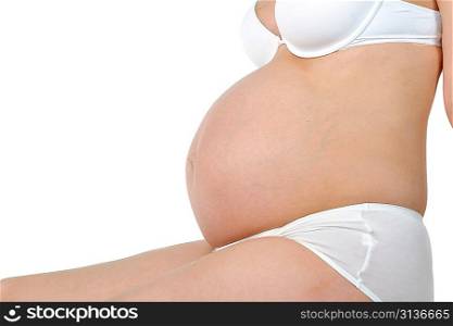 belly of young pregnant woman. close up