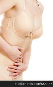 Bellyache or menstruation. Syndroms of indigestion pregnancy. Closeup woman wearing lingerie suffering from stomach pain isolated on white. Woman in lingerie with stomach pain