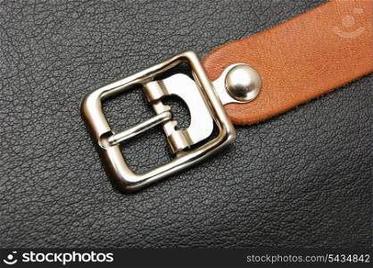 belt with a buckle on a black leather