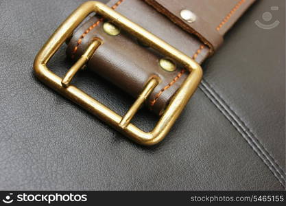 belt with a buckle on a black leather