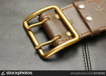 belt with a buckle on a black leather