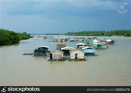 BEN TRE, VIET NAM- MAY 31: Floating residence on river, group of house float on water, Vietnam have many fishing village on water, Bentre, Vietnam, May 31, 2015
