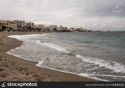 benalmadena beach in spain with buildings in the background