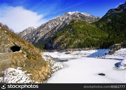 Benasque frozen reservoir Paso Nuevo in Pyrenees of Spain