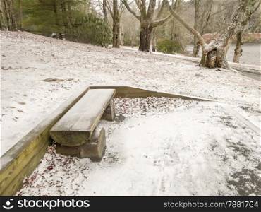 bench in Park in winter with snow