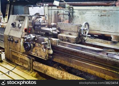 Bench metal lathe machine in turnery workshop