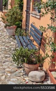 Bench on the street in the old town in Italy