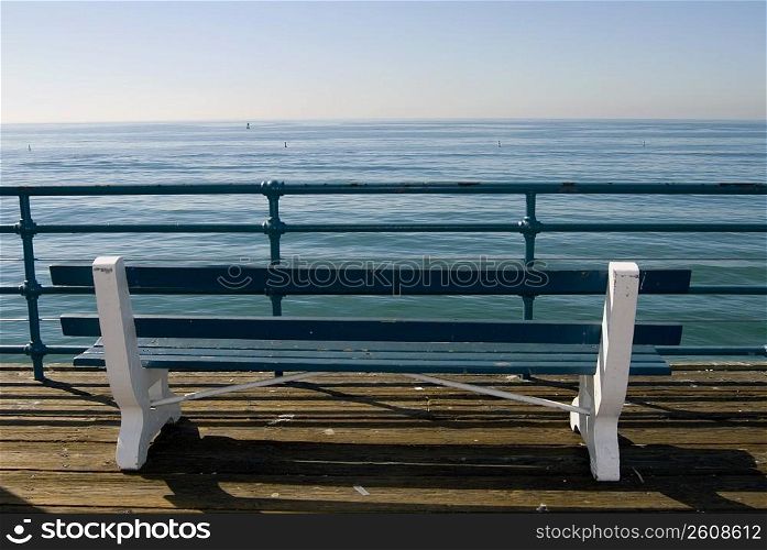 Bench overlooking the ocean on pier