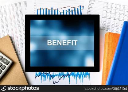 benefit word on tablet with financial graph background