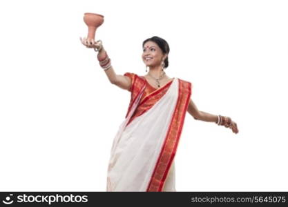 Bengali woman doing Dhunuchi dance