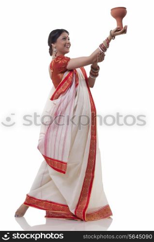 Bengali woman doing Dhunuchi dance