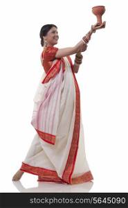Bengali woman doing Dhunuchi dance