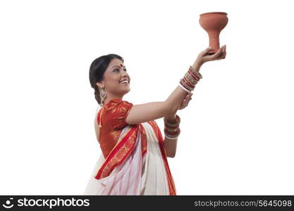 Bengali woman doing Dhunuchi dance