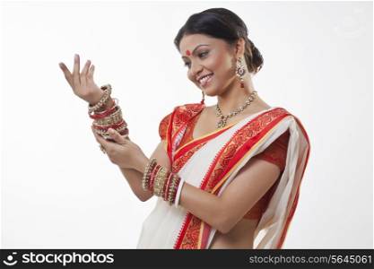 Bengali woman looking at her bangles