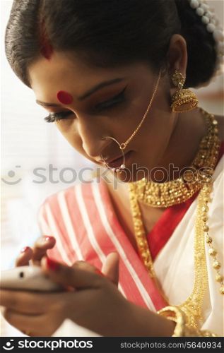 Bengali woman reading an sms