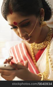 Bengali woman reading an sms