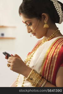 Bengali woman reading an sms