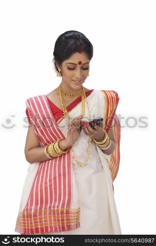 Bengali woman reading an sms on a mobile phone