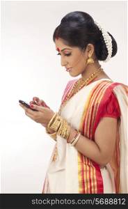 Bengali woman reading an sms on a mobile phone