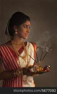 Bengali woman with a puja thali