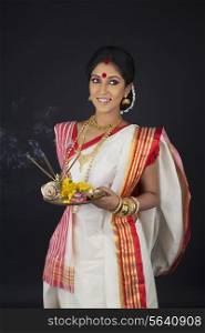 Bengali woman with puja thali