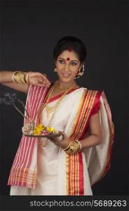 Bengali woman with puja thali