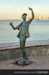 Berdyansk, Ukraine 07.23.2020. Monument to the fisherman on the embankment of Berdyansk, Ukraine, on an early summer morning. Monument to the fisherman on the embankment of Berdyansk, Ukraine