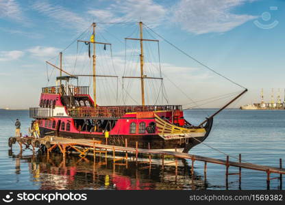 Berdyansk, Ukraine 07.23.2020. Pleasure boats on the embankment of the Azov Sea in Berdyansk, Ukraine, in an early summer morning. Pleasure boats in Berdyansk, Ukraine