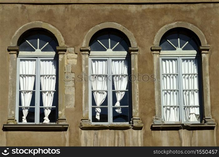 Bergamo, Lombardy, Italy: historic buildings in the main square of the city known as Piazza Vecchia. Three windows