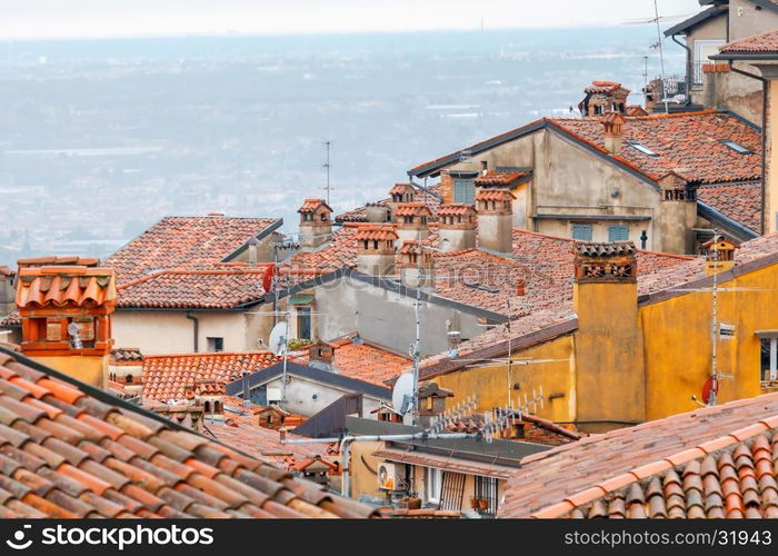 Bergamo. View of the old town.. Scenic view of stone towers and tiled roofs in the old historic part of town. Bergamo. Italy.