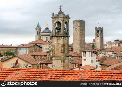 Bergamo. View of the old town.. Scenic view of stone towers and tiled roofs in the old historic part of town. Bergamo. Italy.