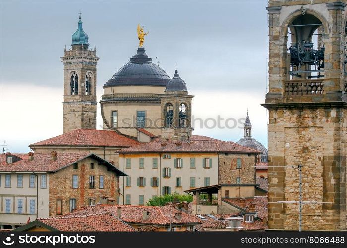 Bergamo. View of the old town.. Scenic view of stone towers and tiled roofs in the old historic part of town. Bergamo. Italy.