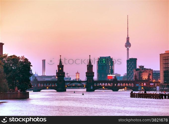 Berlin cityscape with Oberbaum bridge in the evening