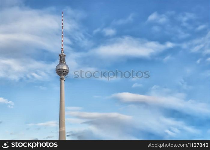 Berlin, Germany - December 9, 2019: The TV Tower in cloudy sky located on the Alexanderplatz in Berlin, Germany. The TV Tower in cloudy sky located on the Alexanderplatz in Berlin, Germany