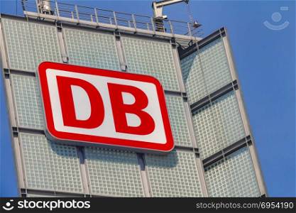 "Berlin, Germany - May 17, 2017: The logo of the brand "Deutsche Bahn" (DB) on a tower at Berlin Main Station (German Hauptbahnhof)"