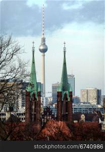 Berlin-TV Tower and Rotes Rathaus-high. TV Tower and the Red City Hall as seen from Berlin Kreuzberg, Germany